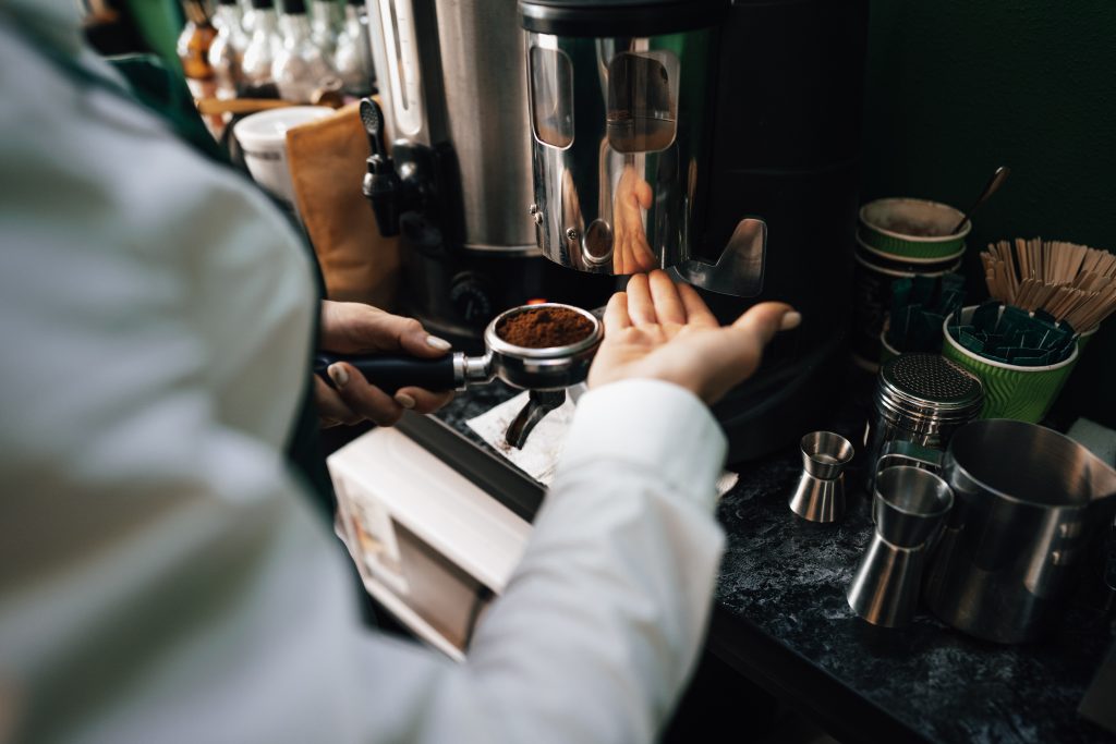 close-up-of-barista-hands-preparing-coffee.jpg